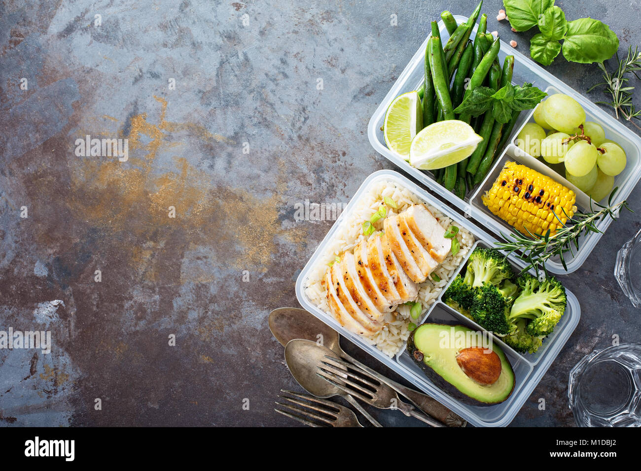Meal prep containers with rice with chicken, baked vegetables, eggs,  sausages and salad for breakfast and lunch overhead shot Stock Photo - Alamy