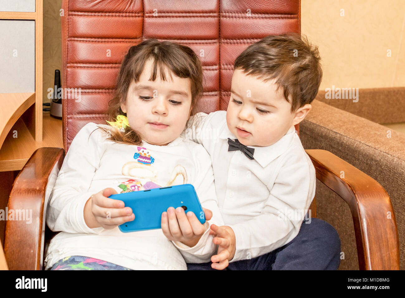 Little children with smartphone Stock Photo