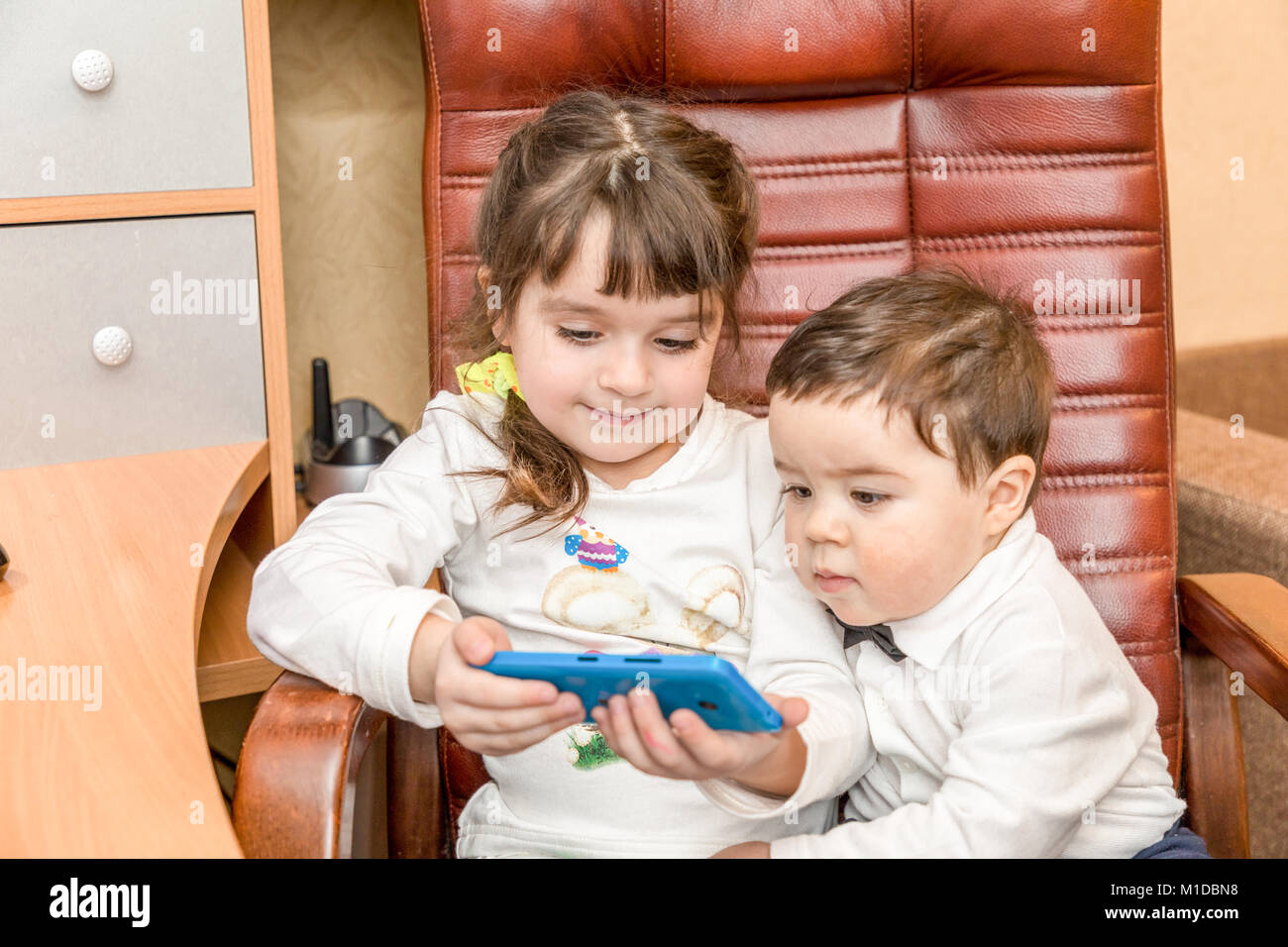 Little children with smartphone Stock Photo