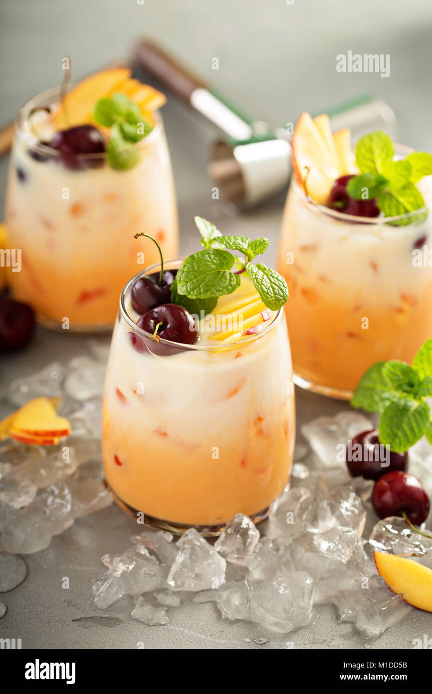Summer cherry and peach coconut milk cocktail Stock Photo Alamy