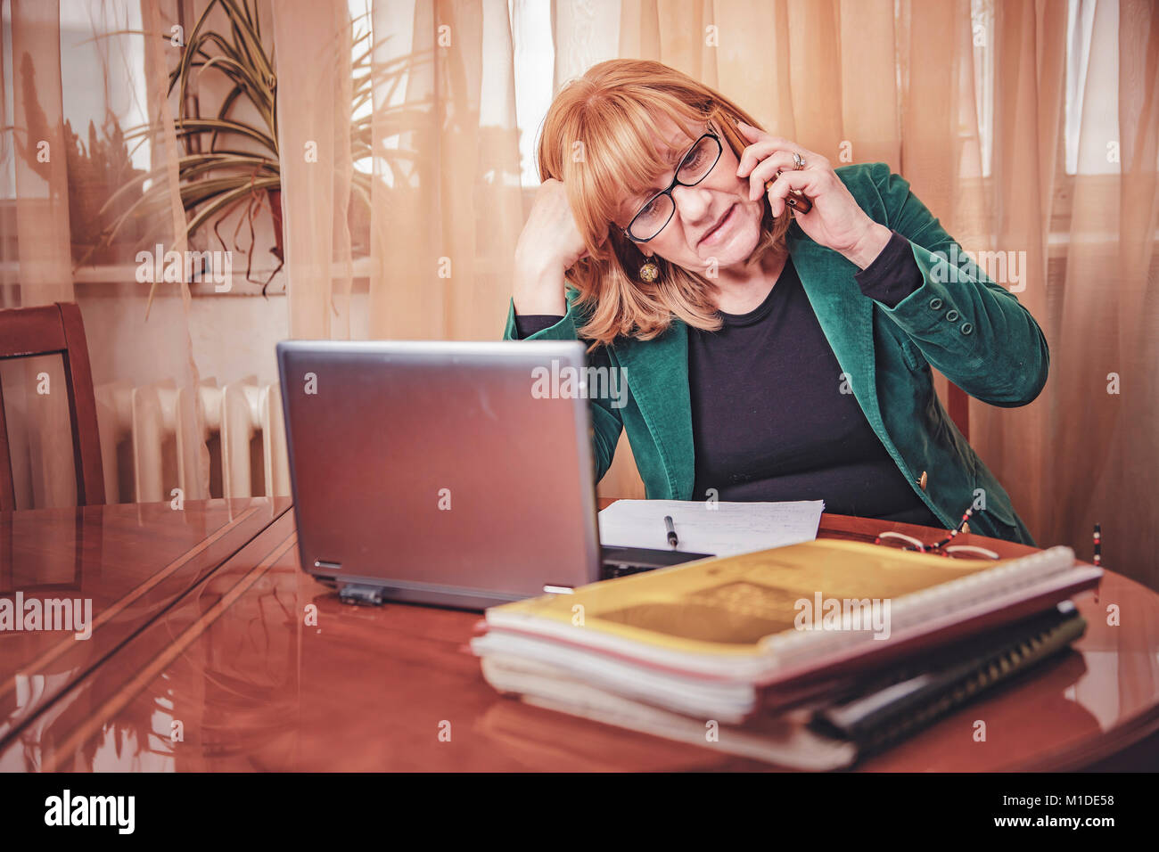 Elderly lady discussing some serious matters Stock Photo