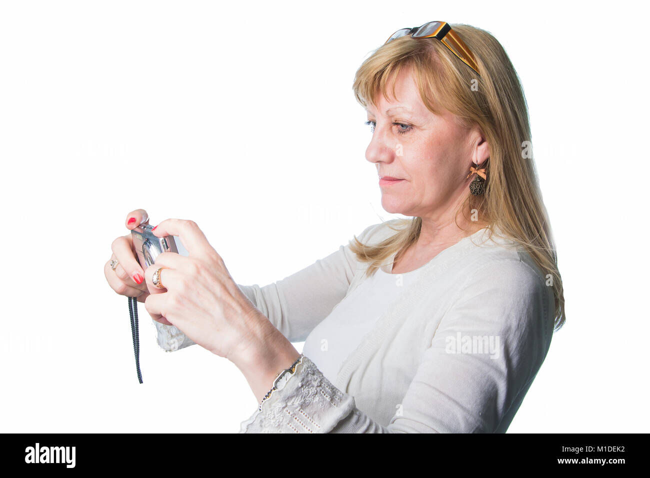 Elderly lady using a compact camera Stock Photo - Alamy