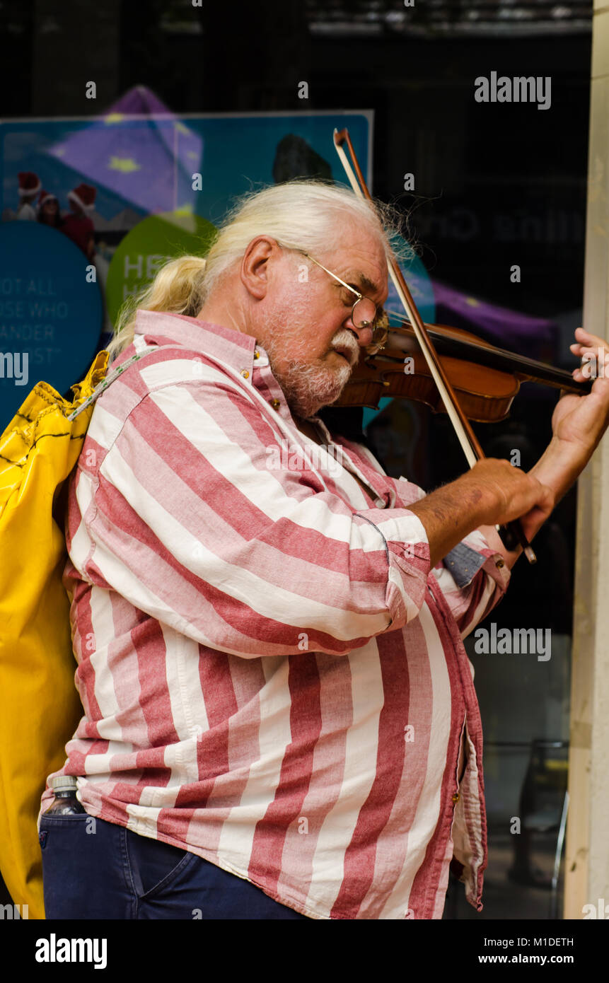 A grey haired man playing a fiddle at Tamworth Australia Country Music Festival. Stock Photo