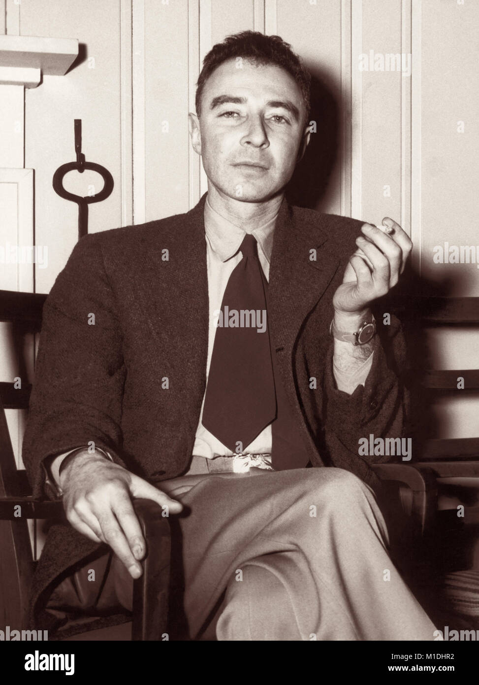 J. Robert Oppenheimer (1904–1967) was an American theoretical physicist and participant in the Manhattan Project's development of the atomic bomb during World War II as wartime head of the Los Alamos Laboratory in New Mexico. Oppenheimer is pictured here at the Guest House (Alexander Inn) at Oak Ridge, Tennessee in a photograph by Ed Wescott on February 14, 1946. Stock Photo