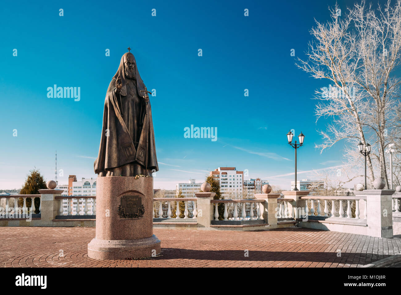 Vitebsk, Belarus. Monument To Patriarch Alexy II Or Alexius II Near Assumption Cathedral Church In Upper Town On Uspensky Hill In Winter Sunny Day. Stock Photo