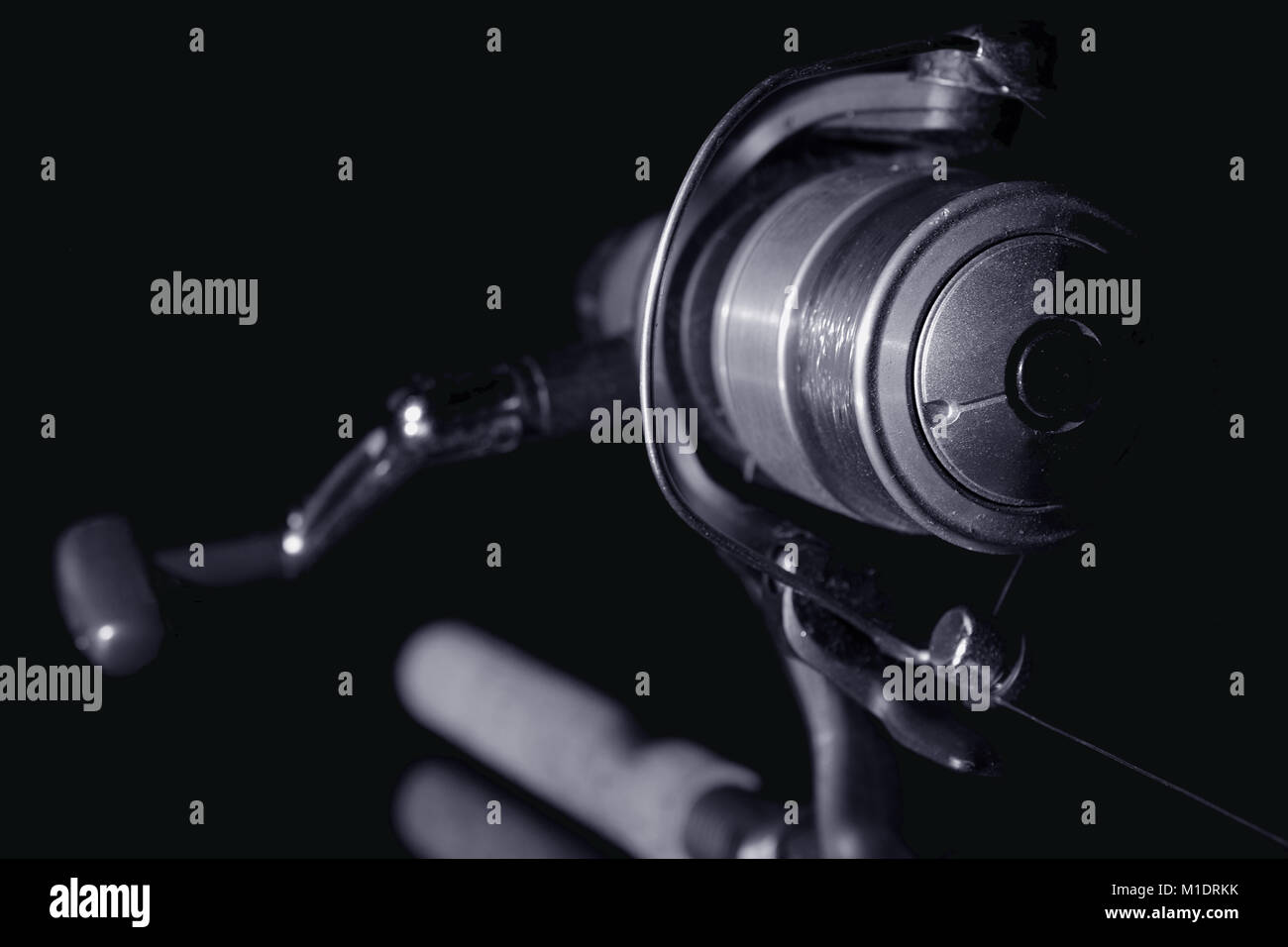 Fishing rod. Stylized spinning reel black and white image Stock Photo