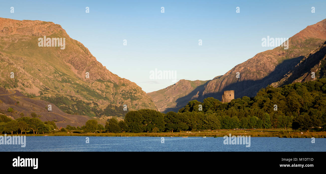 Dolbadarn Castle, Snowdonia, with lake and mountains, North Wales Stock Photo