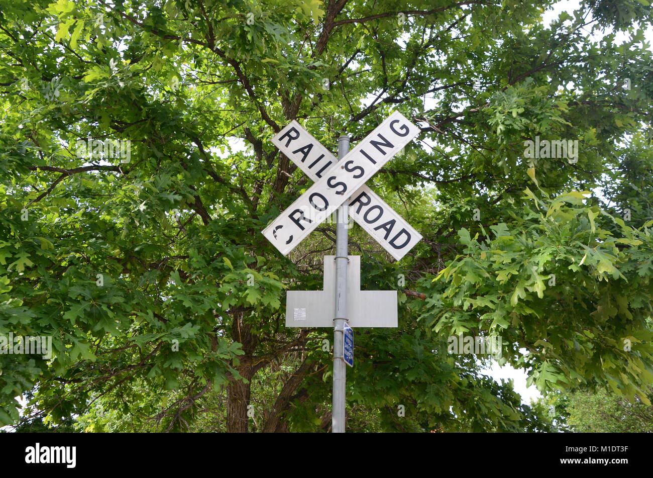 a vintage iron railroad crossing sign in kingsland texas USA Stock Photo