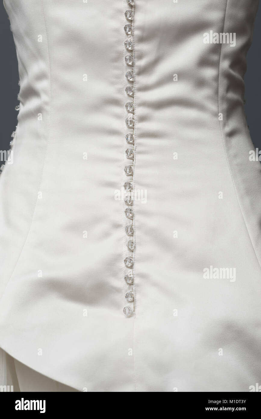 Detailing of traditional wedding dress Stock Photo