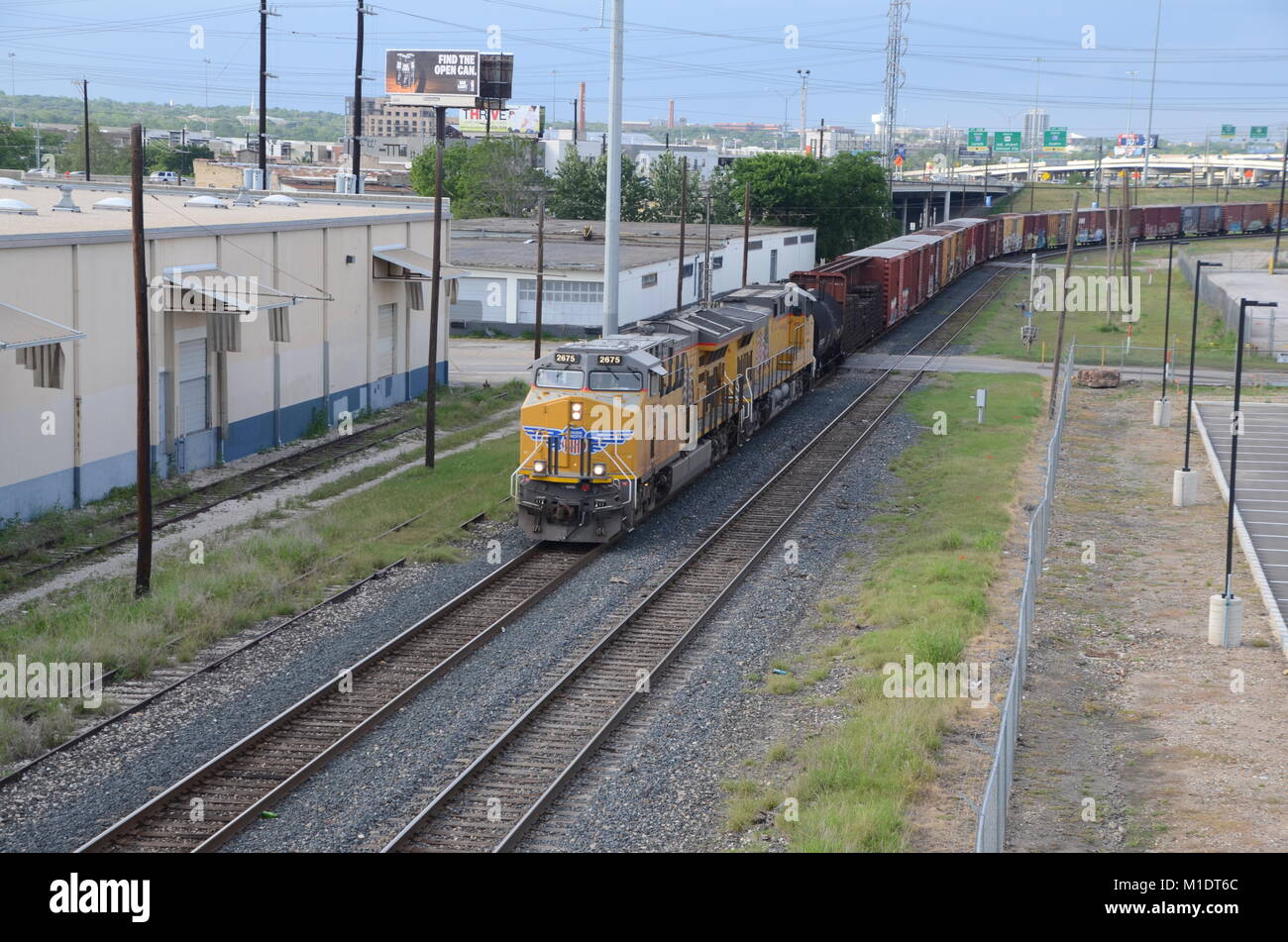 a long freight train passes through san antonio texas Stock Photo