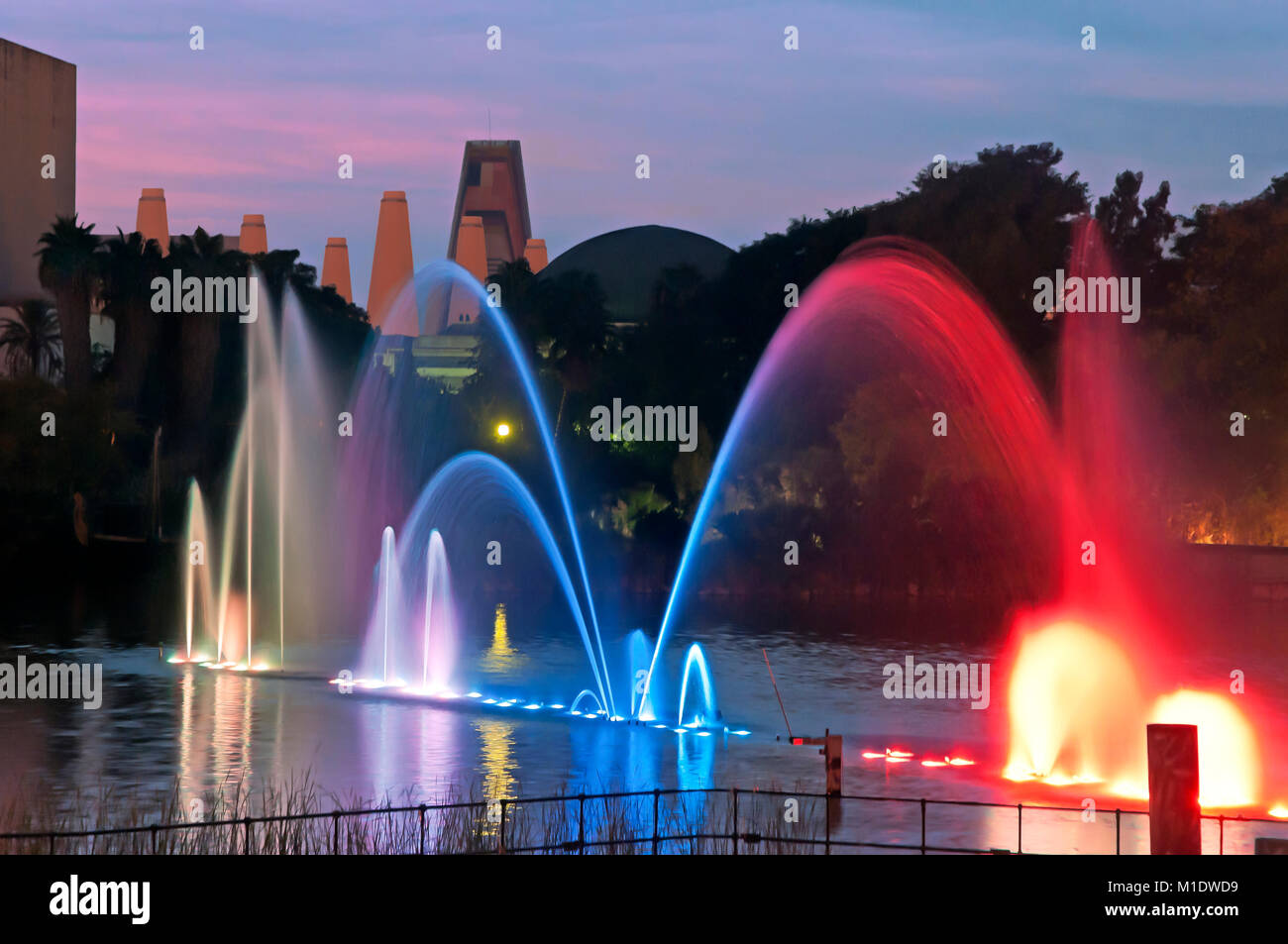 Isla Magica (Magic Island) Theme Park, Lake with water jets at dusk, Seville, Region of