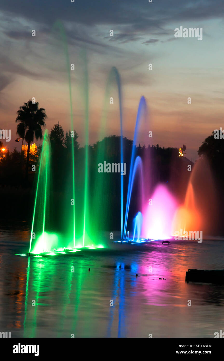 Isla Magica (Magic Island) Theme Park, Lake with water jets at dusk