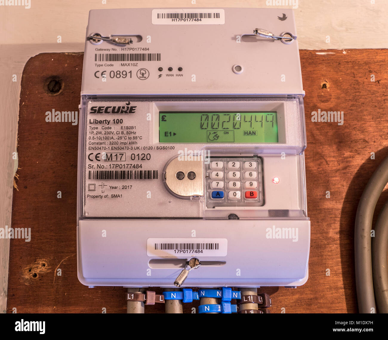 Secure Liberty 100 smart electricity meter, measuring consumption and relaying cost information in pounds sterling, via the display panel. UK. Stock Photo