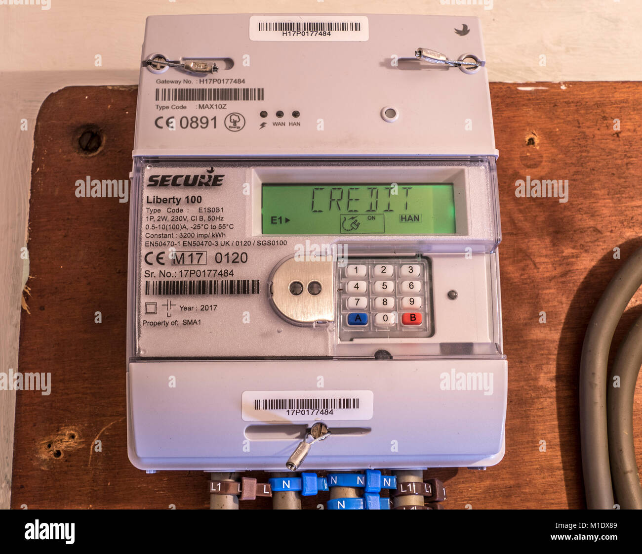 Secure Liberty 100 smart electricity meter, measuring consumption and relaying 'Credit' information via the display panel. UK. Stock Photo