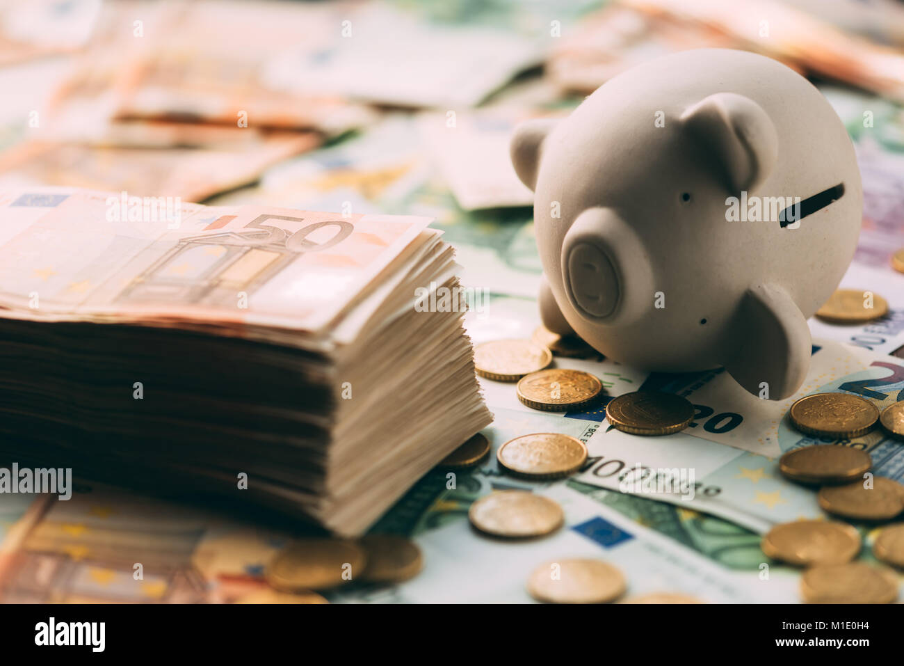 Piggy moneybox with euro cash Stock Photo