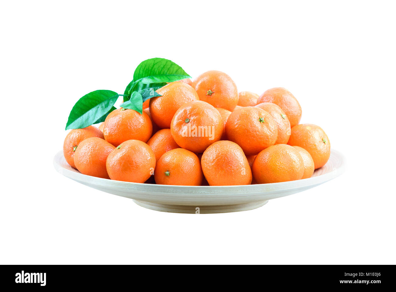 Heap of mandarin in bamboo plate isolated Stock Photo