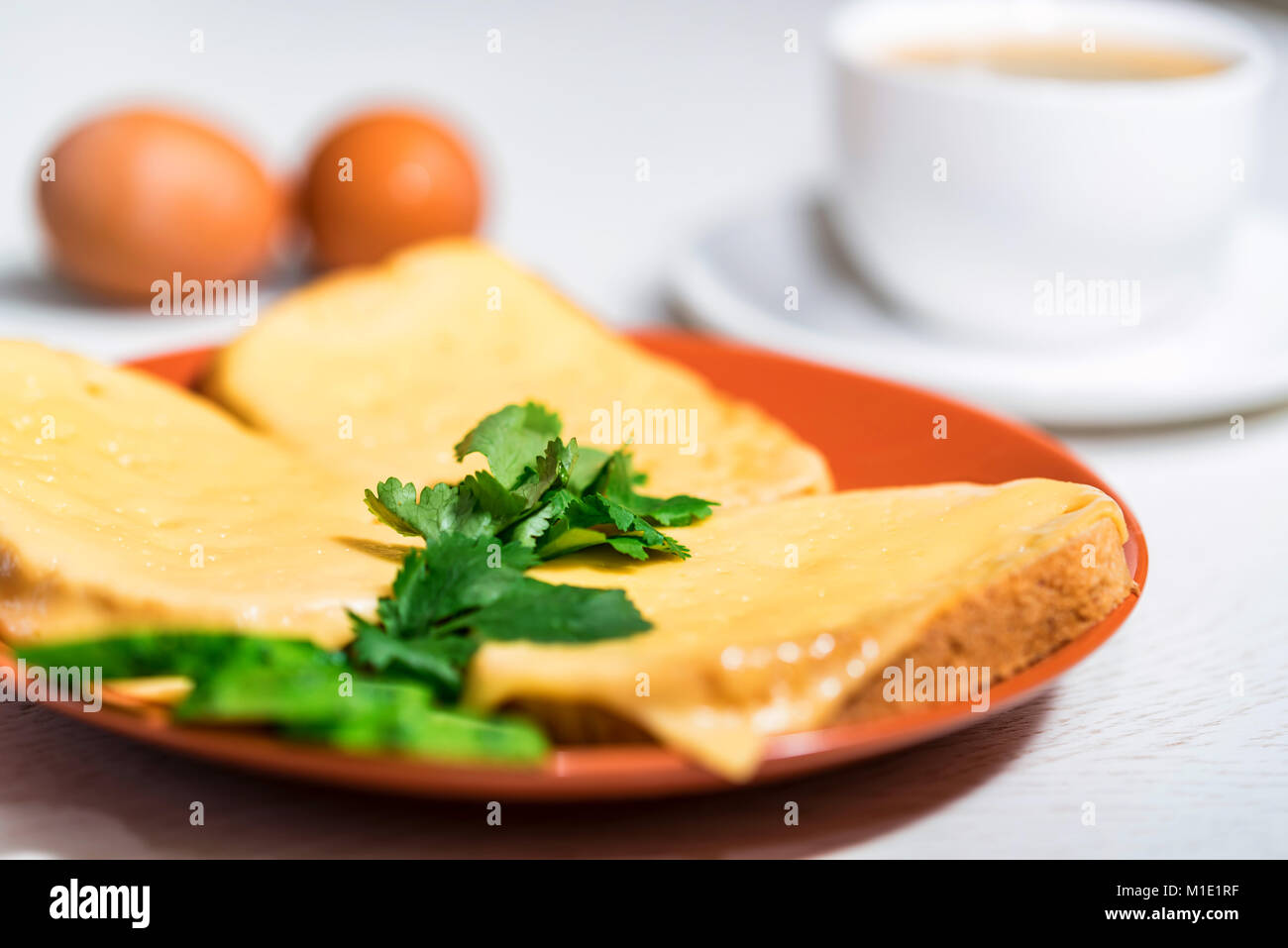 Breakfast of cheese sandwich, eggs and coffee Stock Photo - Alamy