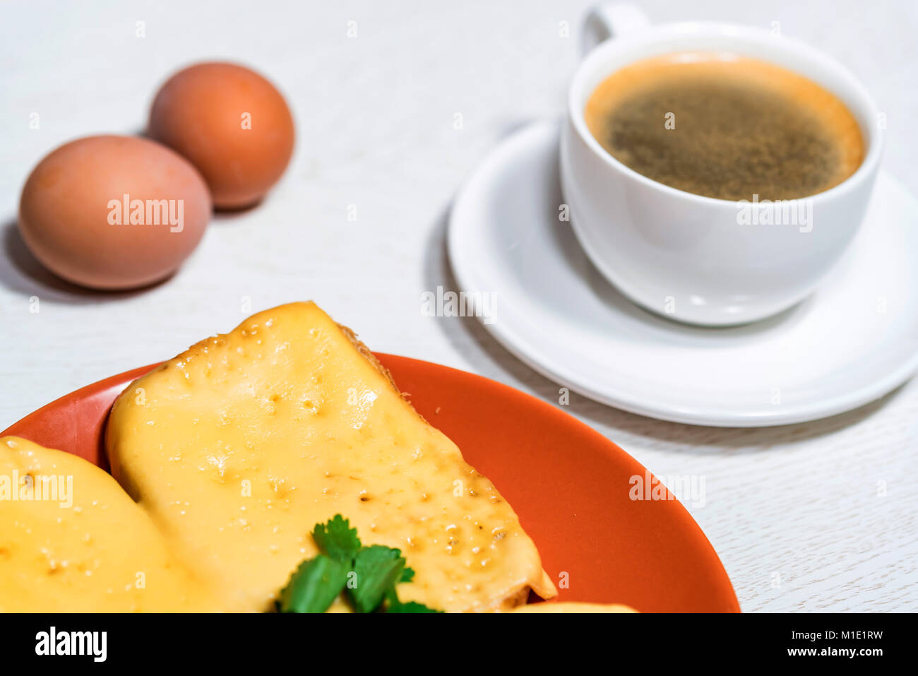 Breakfast of cheese sandwich, eggs and coffee Stock Photo - Alamy