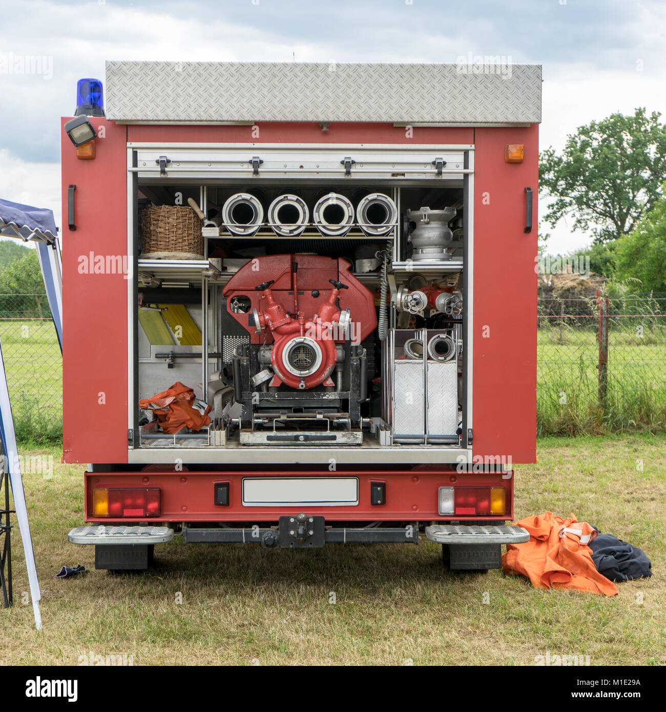 Rear of a fire engine with hoses and pump Stock Photo