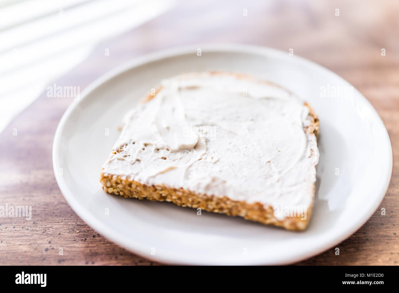 Closeup of slice piece of whole wheat sprouted toasted grain bread on