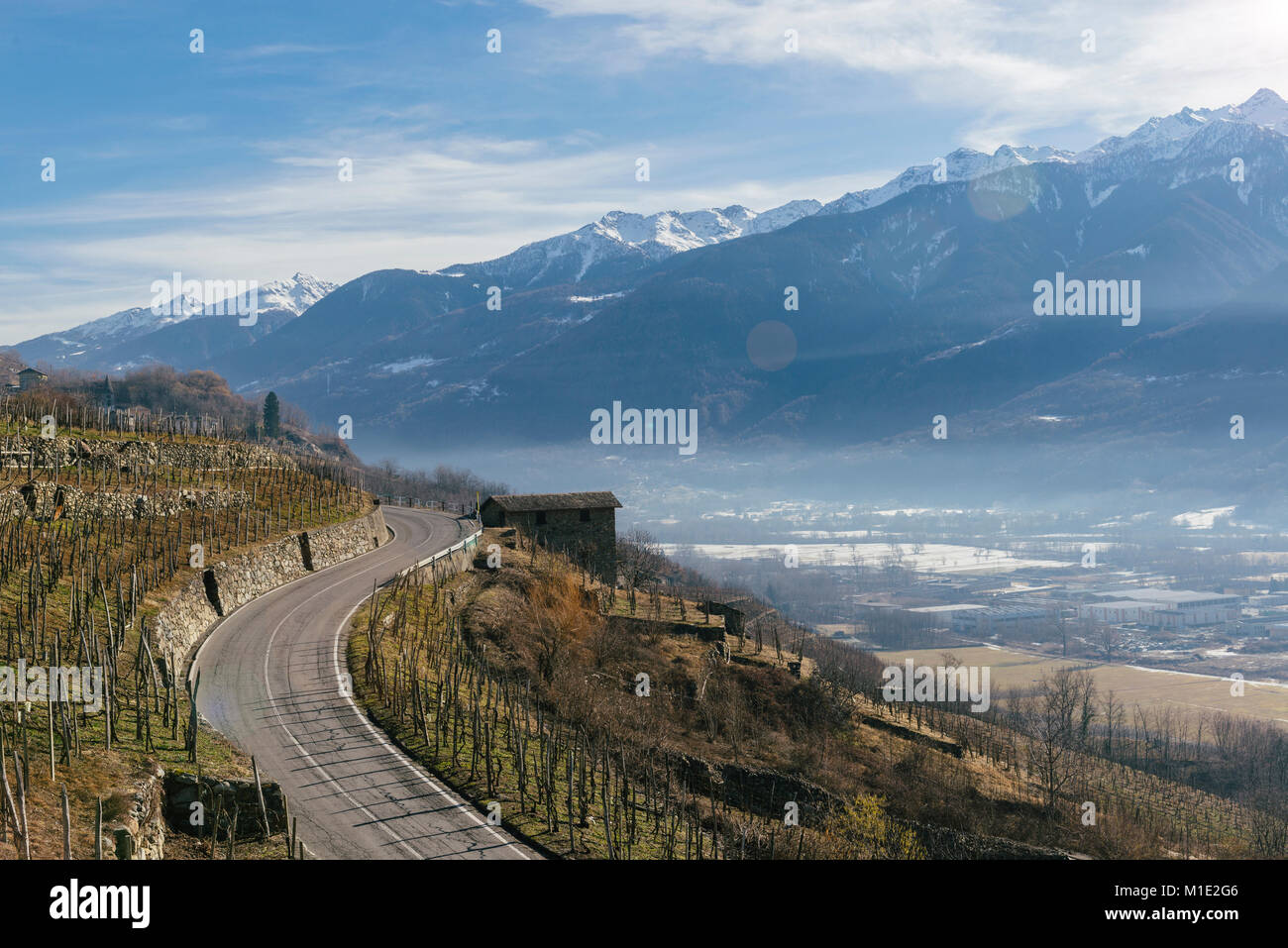 Swerving roads in Valtellina, a valley near Sondrio in the Lombardy region of northern Italy, bordering Switzerland Stock Photo