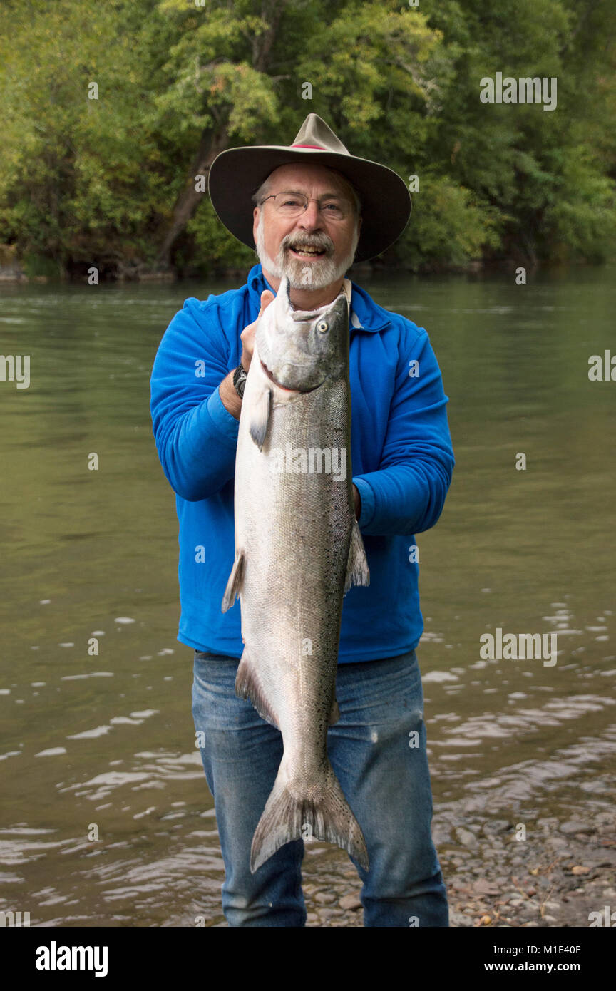 Outdoor writer Terry Sheely with a bright Chinook salmon, caught on the Klickitat,River,in Washington State, Stock Photo