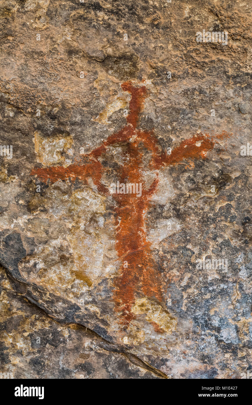 Pictograph of a human figure done in red pigment, created by Ancestral Puebloan People at their camp at Cave Spring in The Needles District of Canyonl Stock Photo