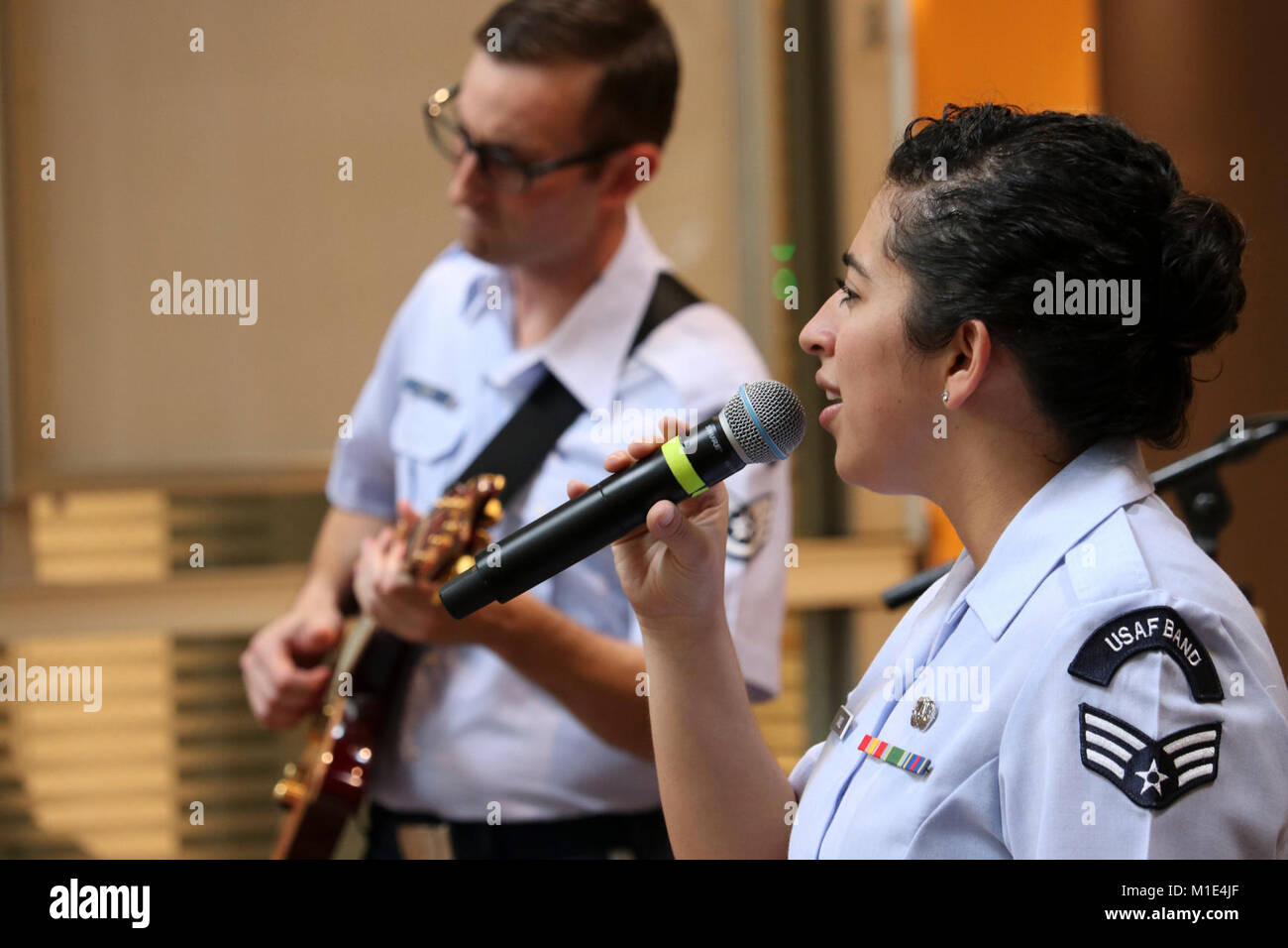 Senior Airman Alycia Cancel, U.S. Air Force Band of Pacific-Asia vocalist, sings during a concert in Saitama, Japan, Sept. 26, 2017. Cancel performs at various locations throughout the Indo-Asia Pacific Region to strengthen the relations with our host nations and to support military ceremonies such as retirements, award ceremonies, graduations, promotions and change of commands, at various schools, parades and sporting events. (U.S. Air Force Stock Photo