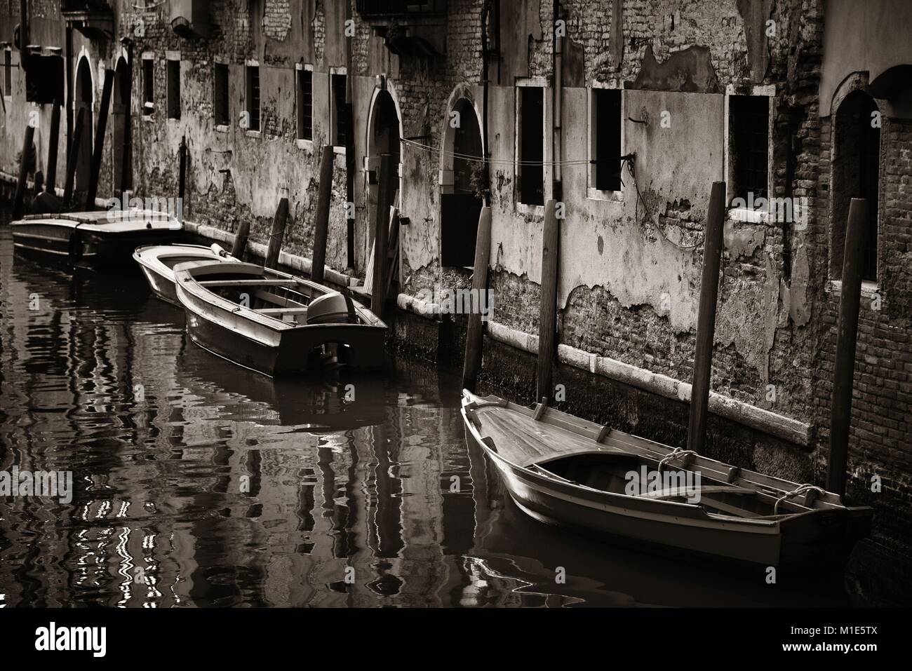 Boat park in Venice alley canal. Italy Stock Photo - Alamy
