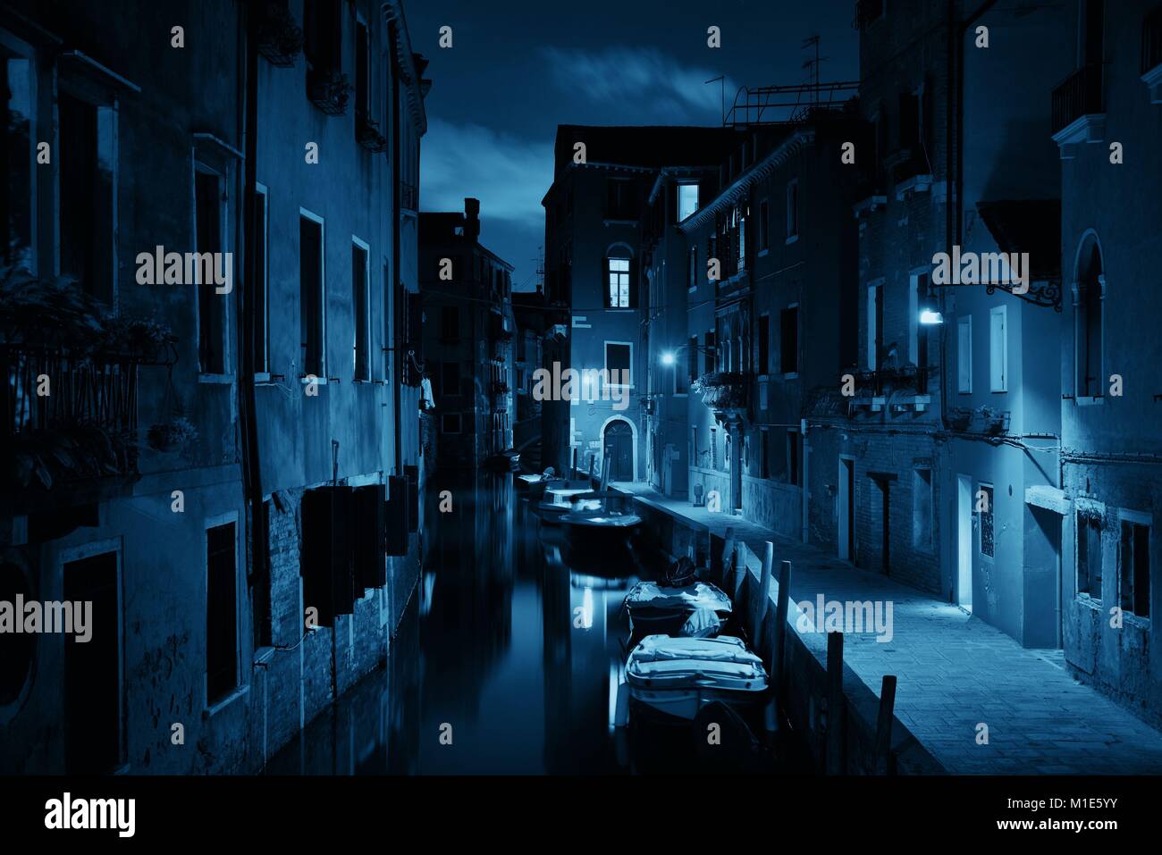 Venice canal view at night with historical buildings. Italy Stock Photo ...