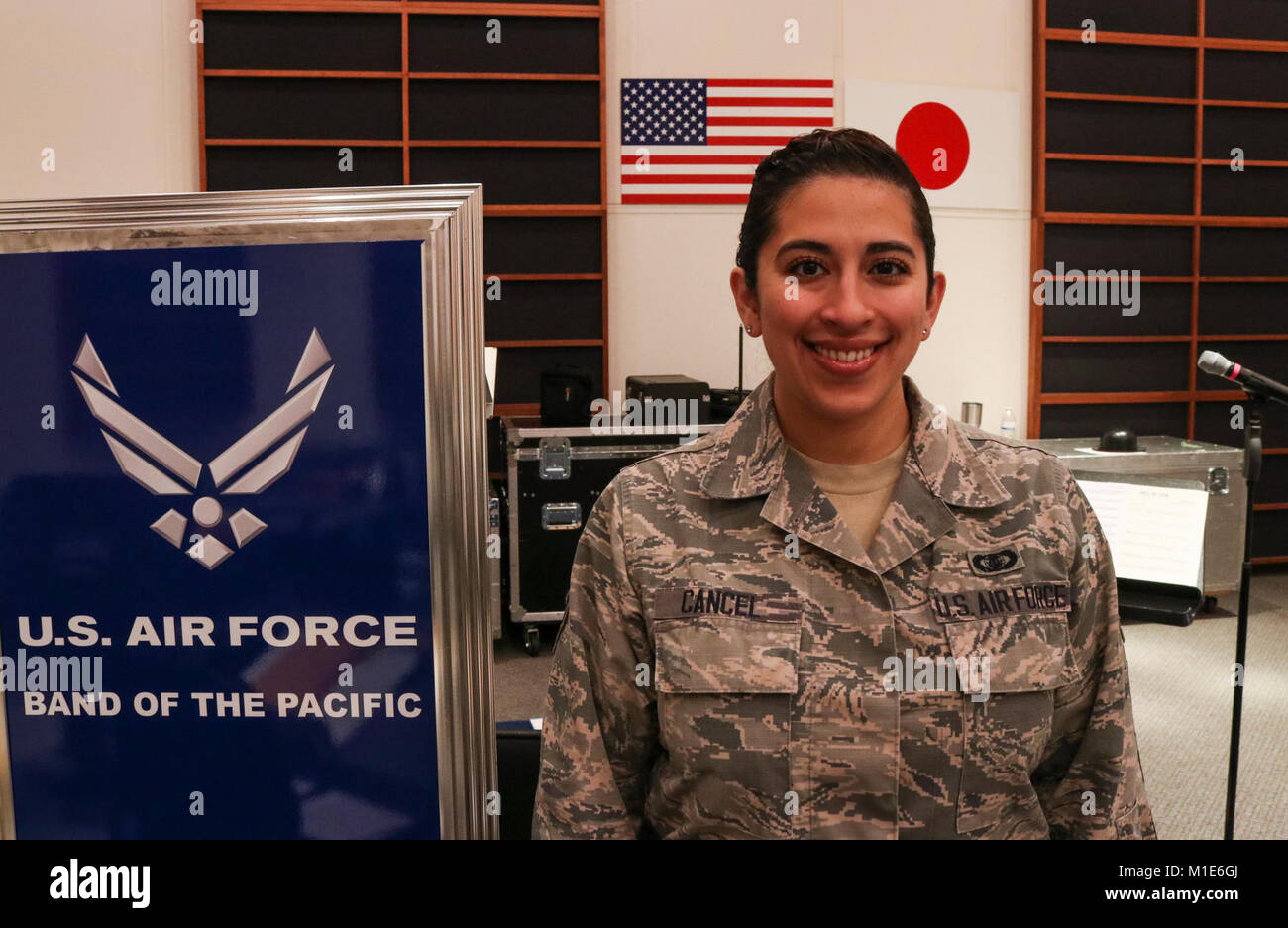 Senior Airman Alycia Cancel, U.S. Air Force Band of Pacific-Asia vocalist, stands inside a band studio at Yokota Air Base, Japan, Jan. 19, 2018. Cancel joined the Air Force band as a way to gain experience performing prior to becoming a music teacher. (U.S. Air Force Stock Photo