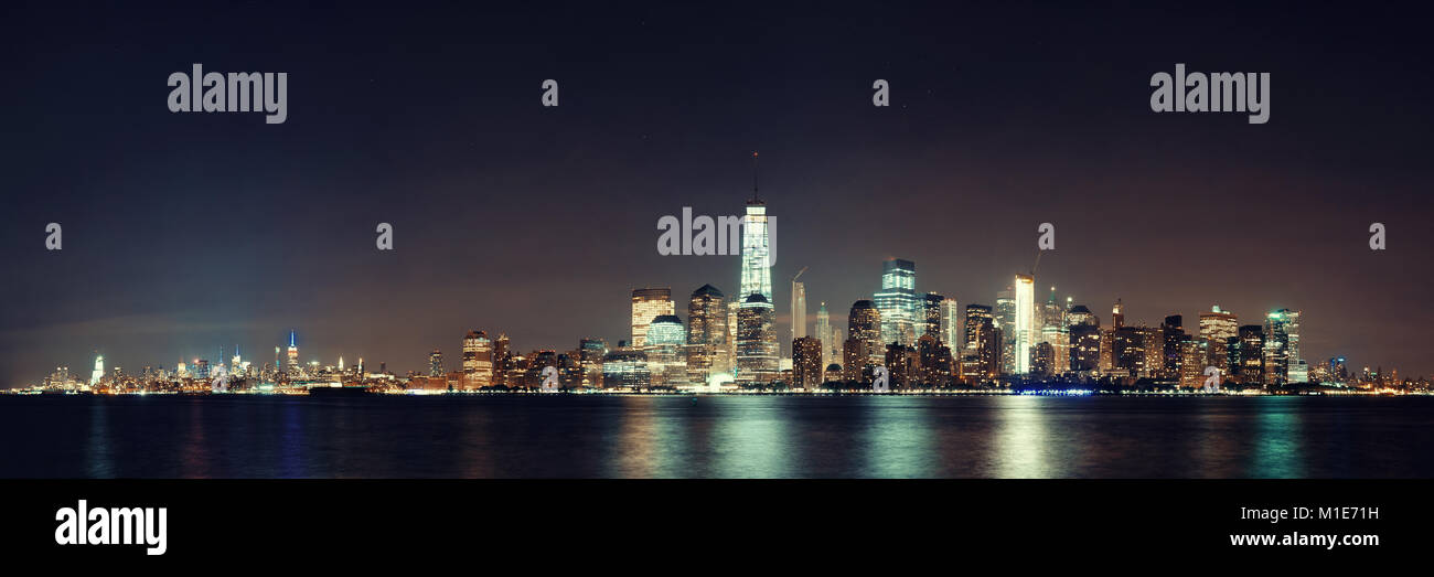 New York City downtown skyline at night panorama over Hudson River ...