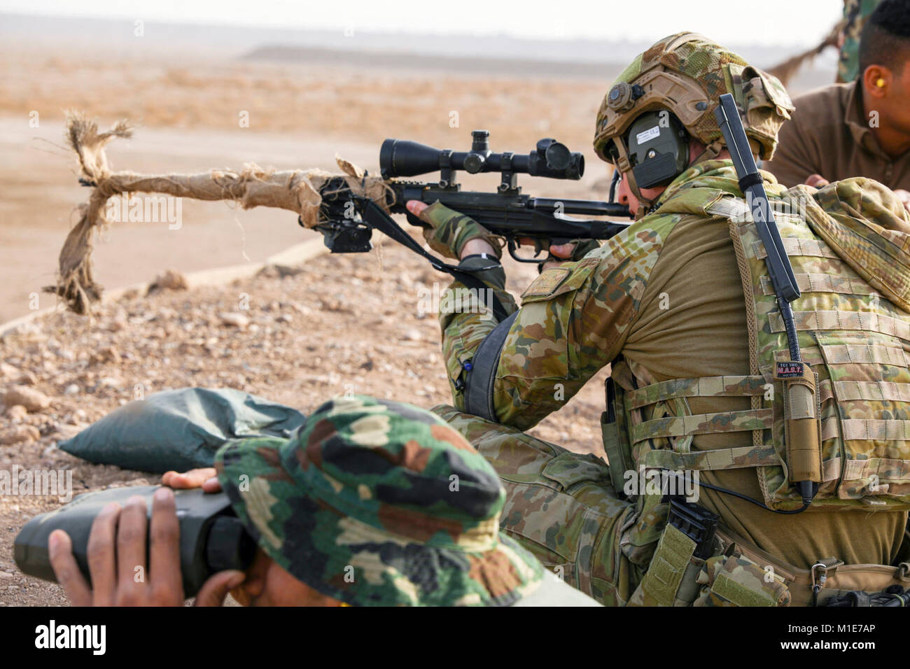 An Australian Army trainer demonstrates a good seated firing position Stock  Photo - Alamy