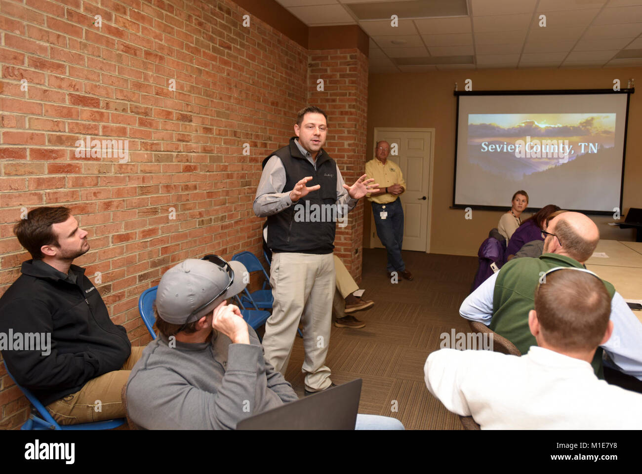 Bryan McCarter, vice mayor of Sevierville, Tenn., welcomes members of Tennessee Silver Jackets to the city's emergency management center Jan. 25, 2018. The Silver Jackets team received a briefing on the wildfires that moved through Sevier County and city of Gatlinburg in November 2016. Silver Jackets is an innovative partnership where local, state and federal agencies facilitate flood risk reduction, coordinates programs, promotes cohesive solutions, synchronizes plans and policies, and ultimately provides integrated solutions. (USACE Stock Photo