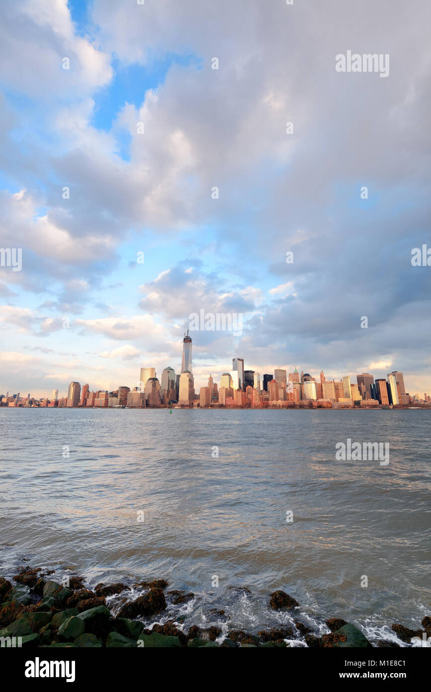 Downtown Manhattan skyline at sunset over Hudson River in New York City ...