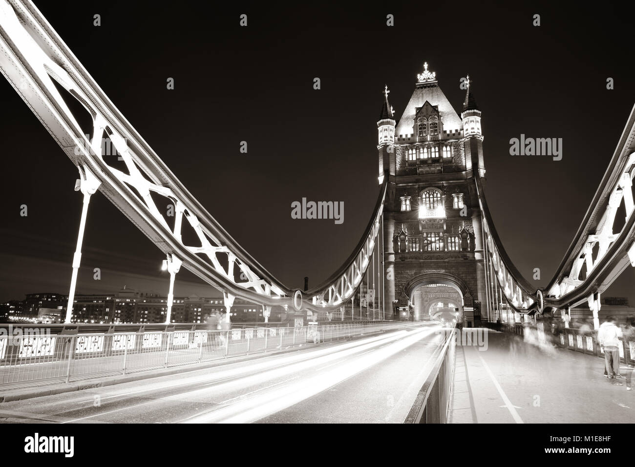Tower Bridge in London with busy traffic at night Stock Photo - Alamy