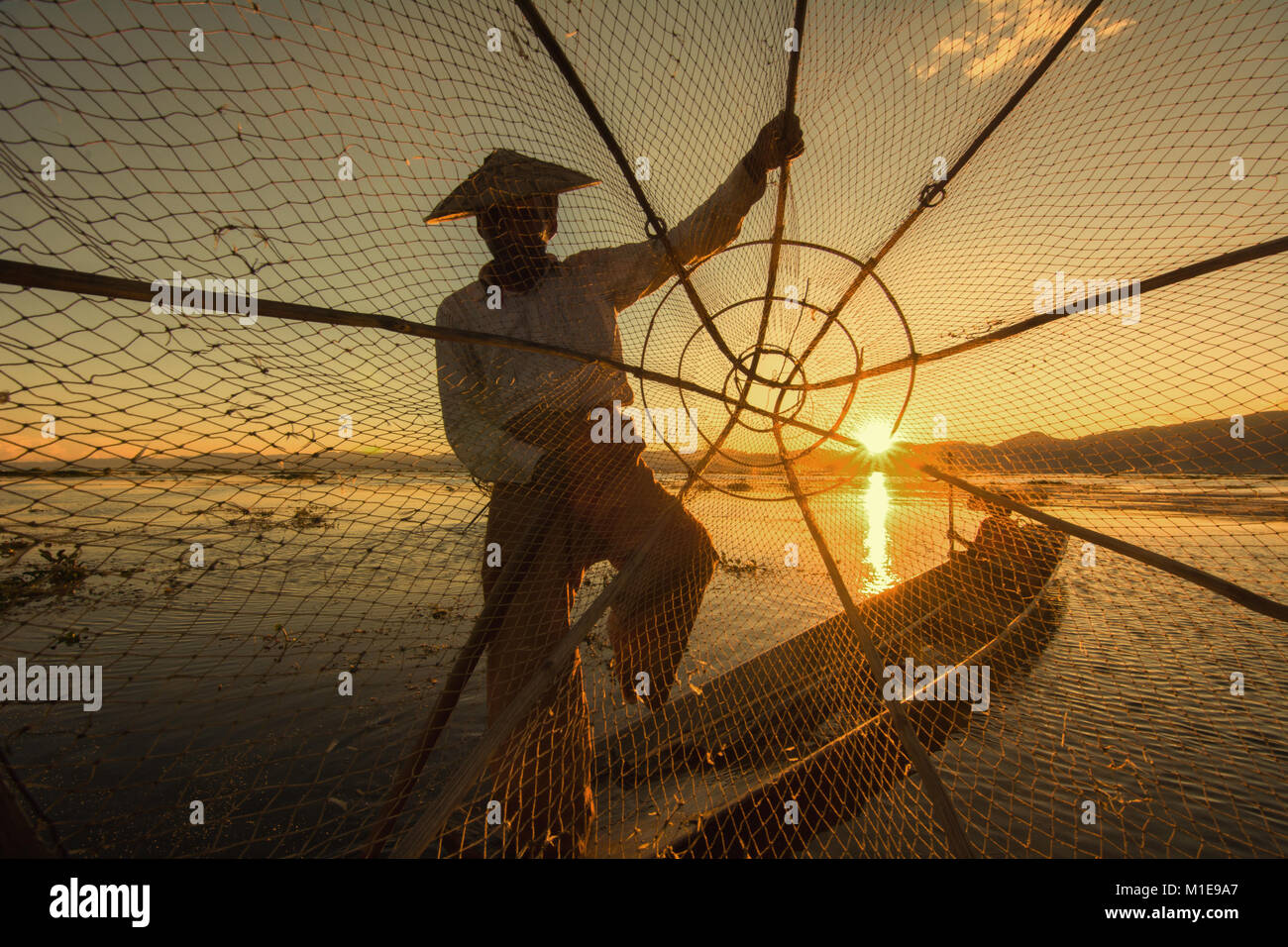 Silhouette of fisherman at sunset Inle Lake Burma Myanmar Stock Photo ...