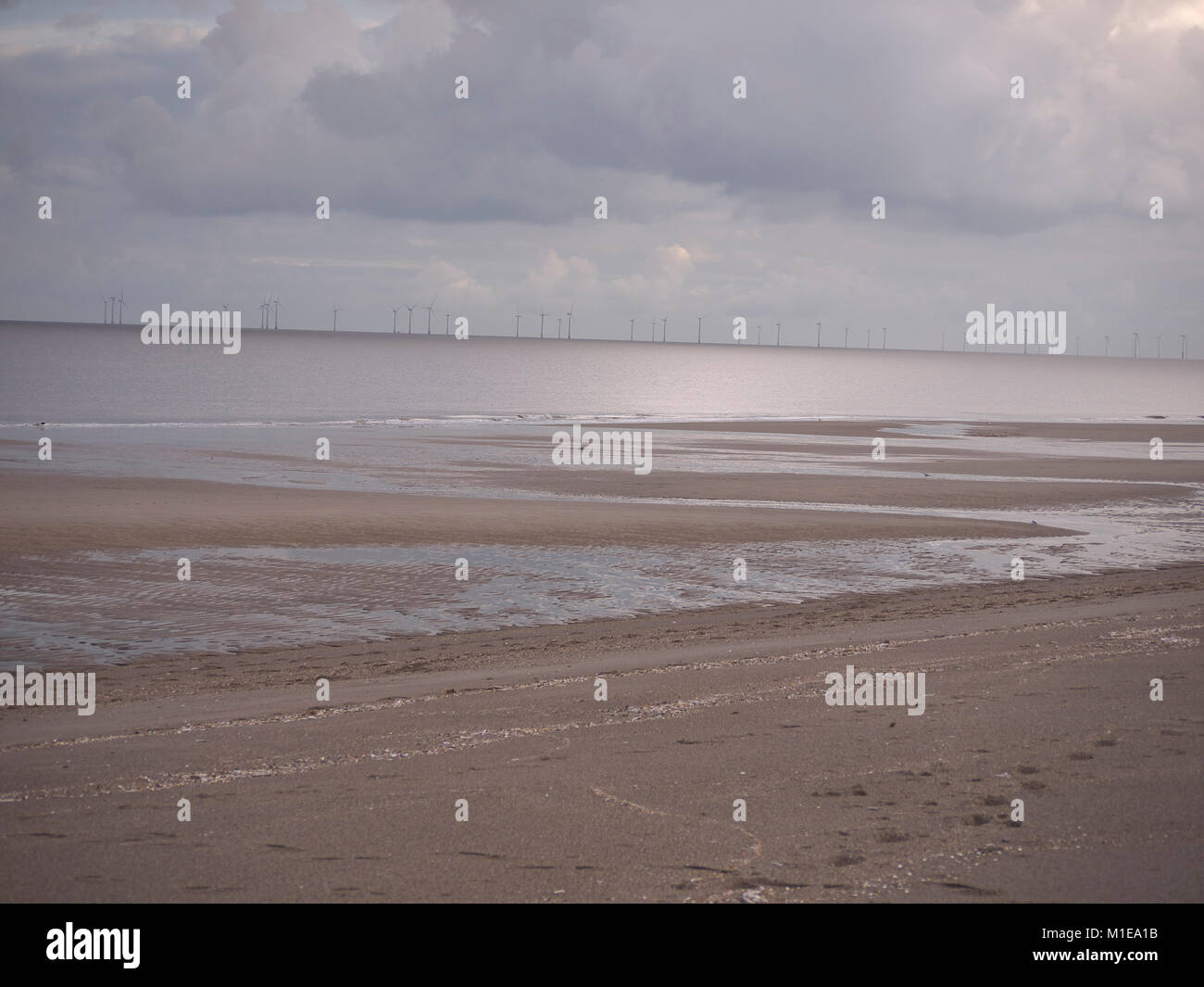 Mablethorpe beach with a view of the off shore Wind farm Stock Photo