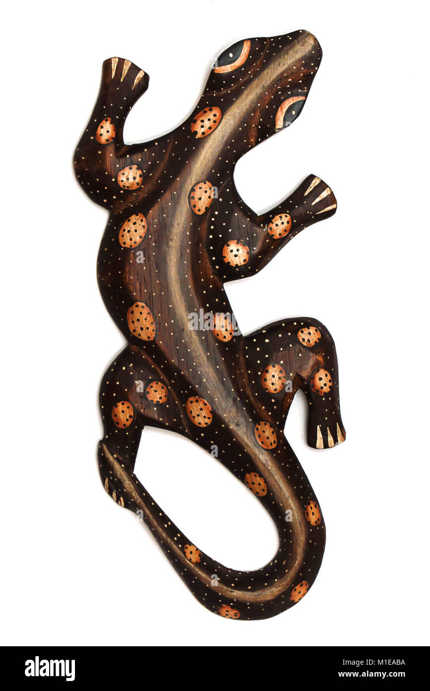 Handmade antique african wooden lizard isolated on white Stock