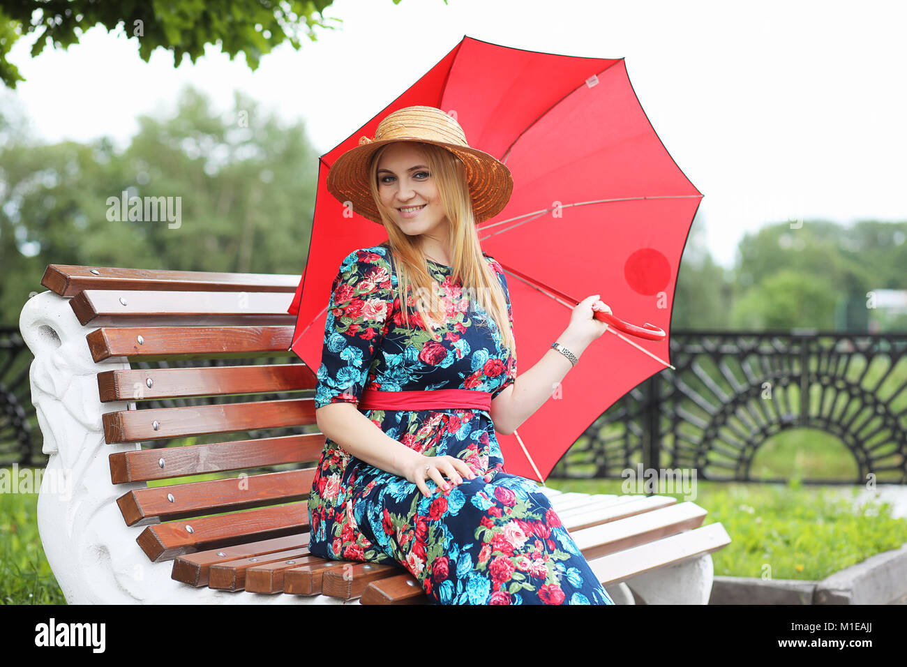 Girl in the street with an umbrella Stock Photo - Alamy