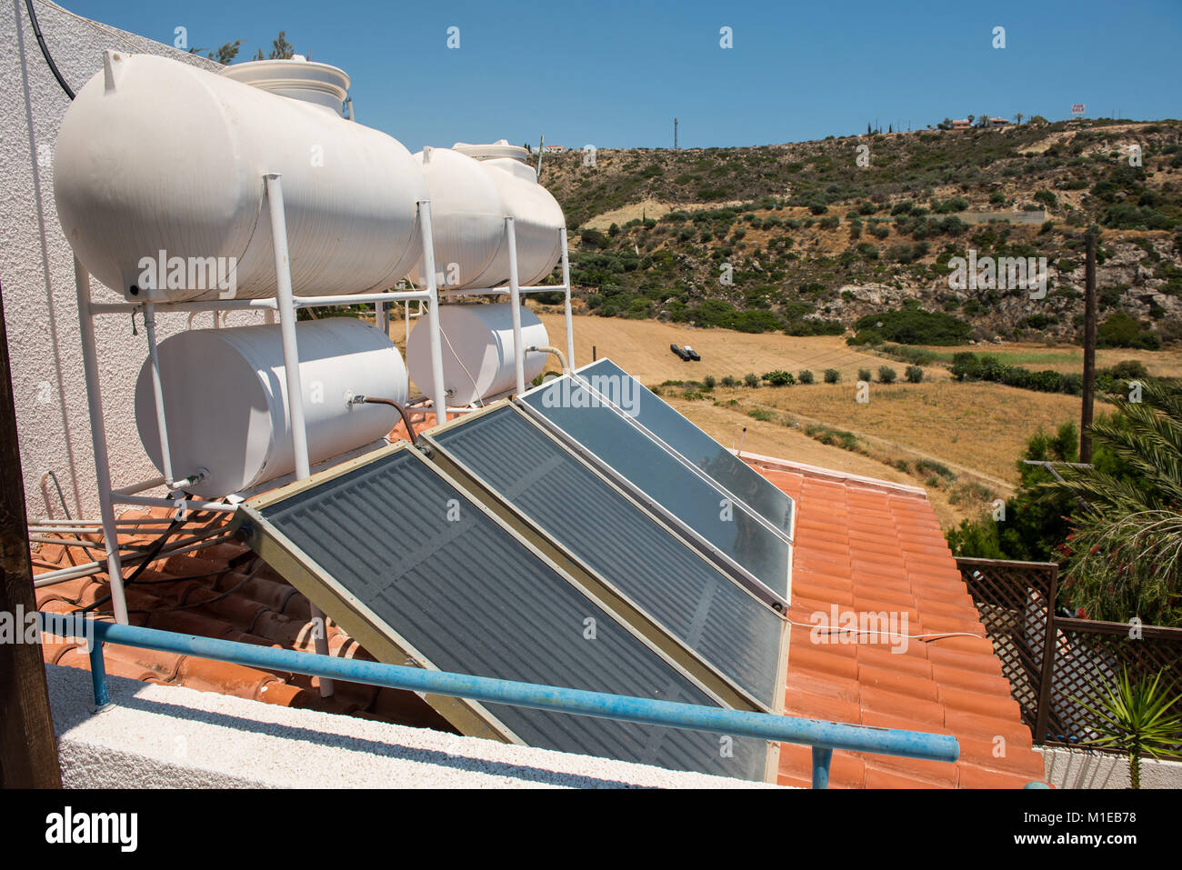 Green energy concept. Solar water heater on the roof of a house Stock ...