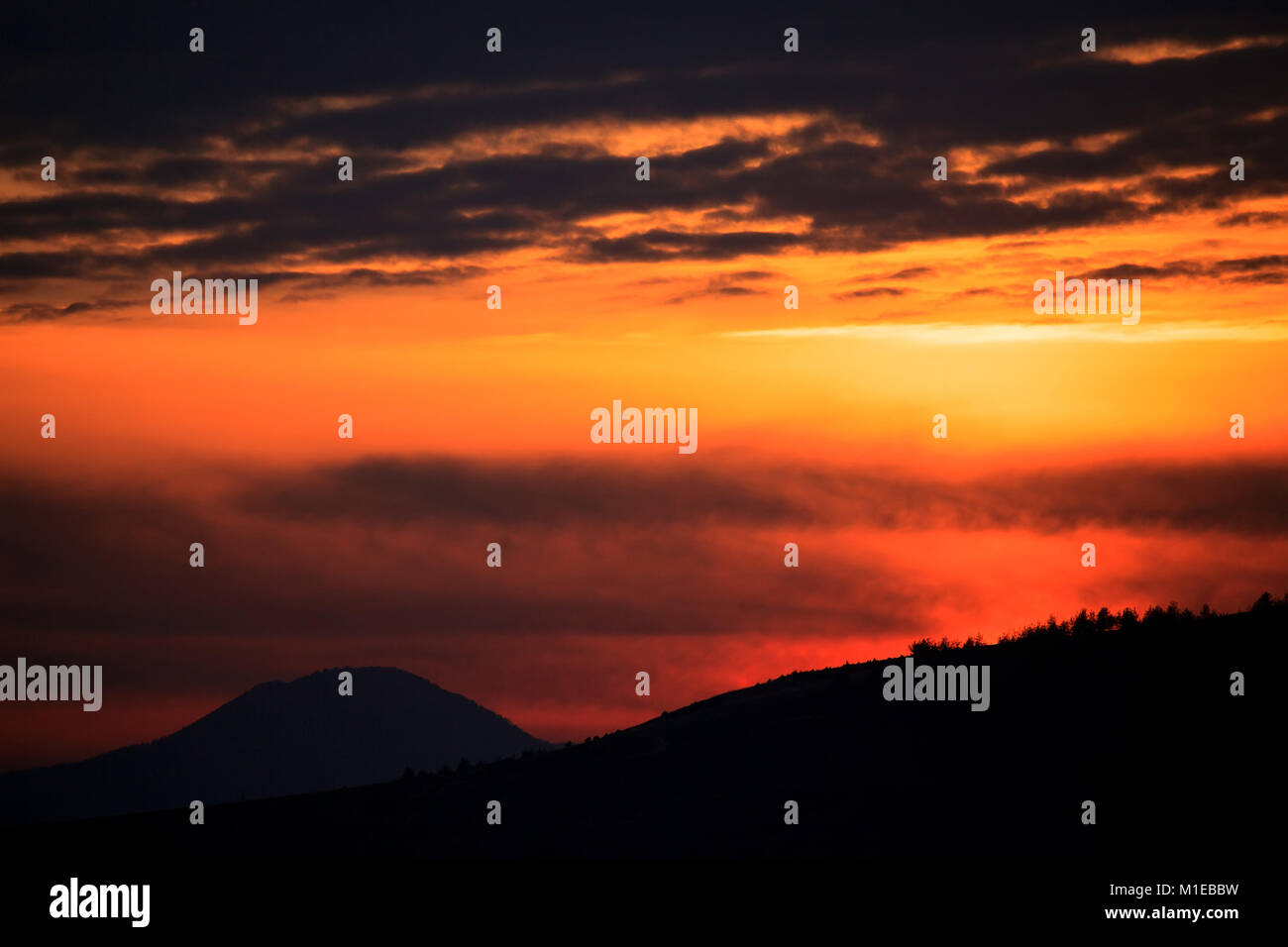 abstract silhouette of mountains in stunning red sunset Stock Photo - Alamy