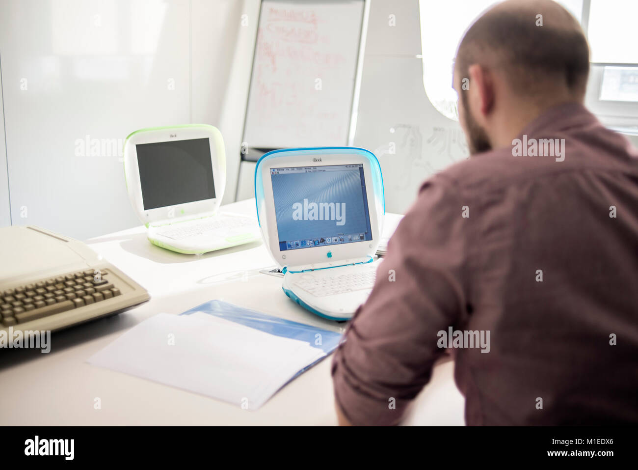 A Member Of Staff Shows Ibook G3 Release Date May 01 With Apple Stock Photo Alamy