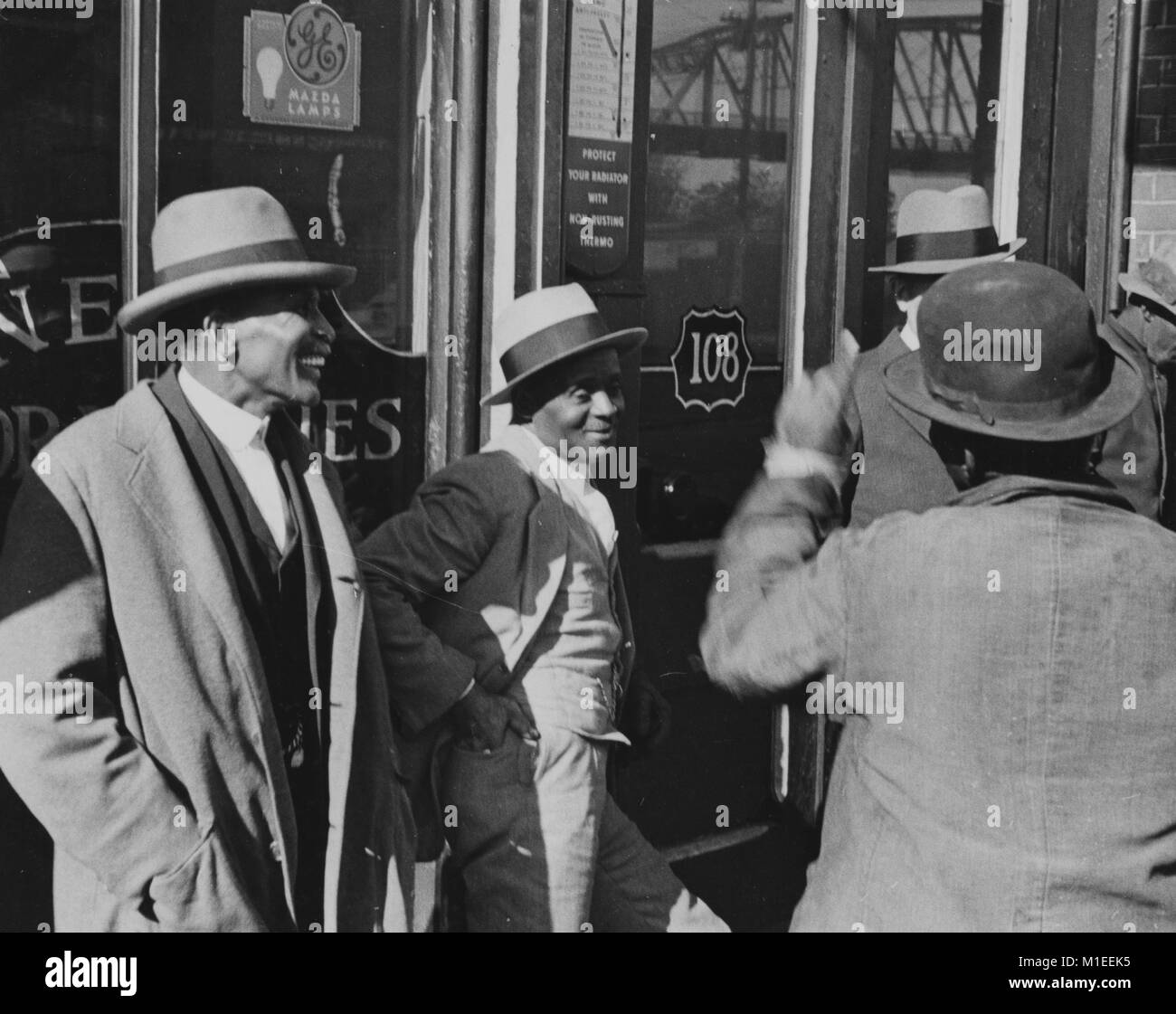 Four African American men talking at religious gathering, Nashville, Tennessee, USA, 1935. From the New York Public Library. () Stock Photo