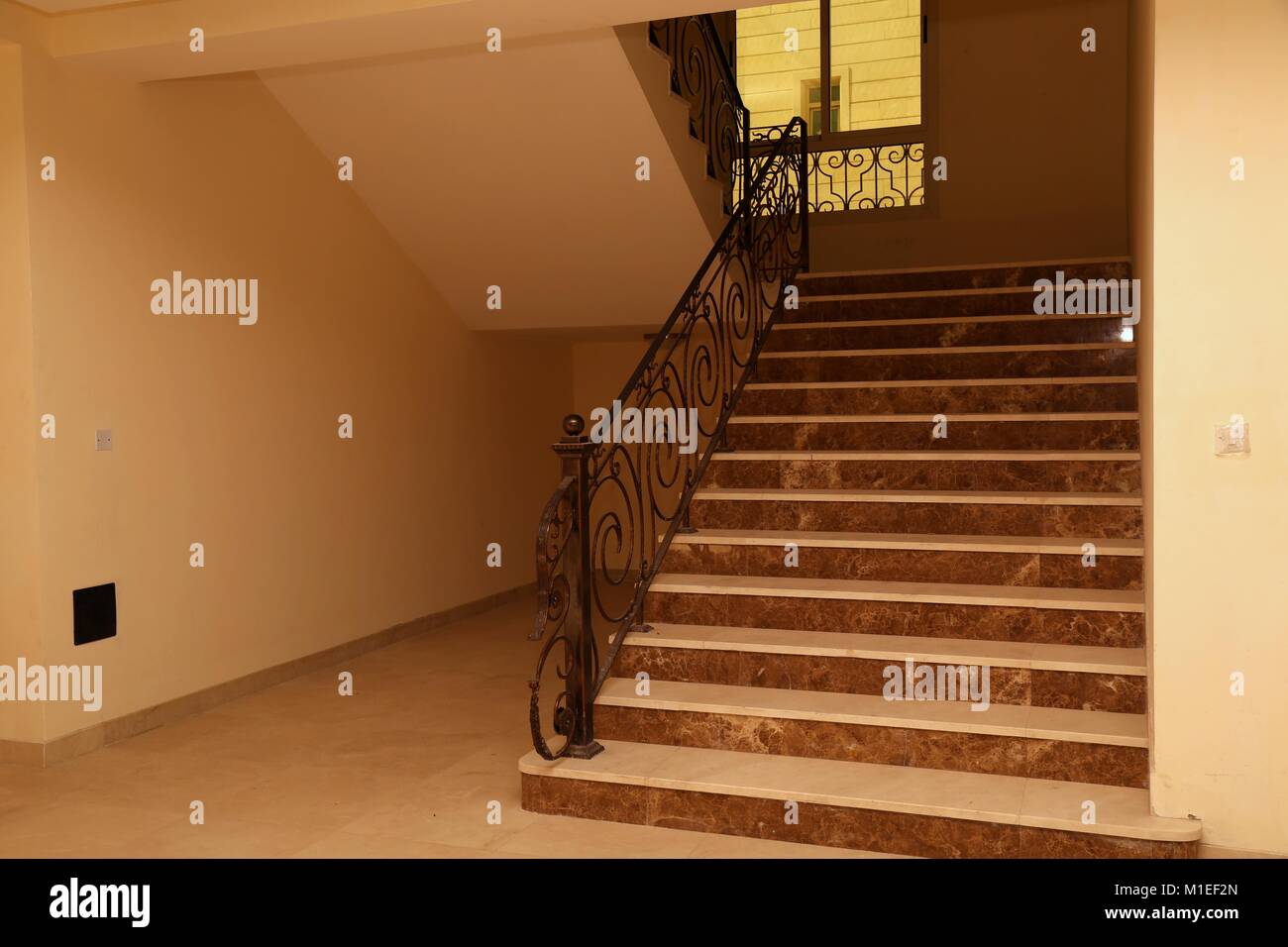 Marble Staircase with Wrought Iron Handrails Stock Photo