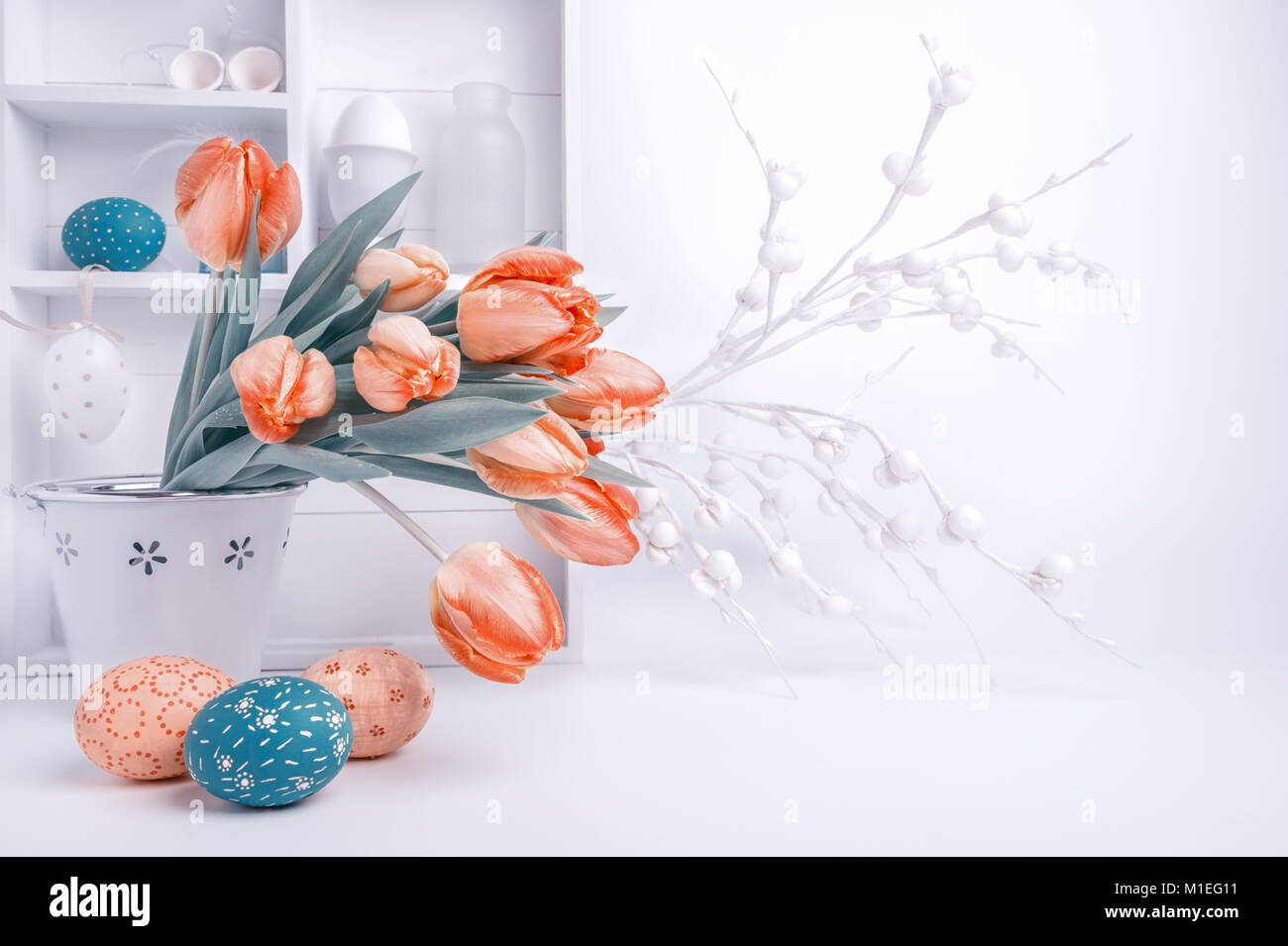 Easter greeting card design with bunch of tulips and painted eggs on ...