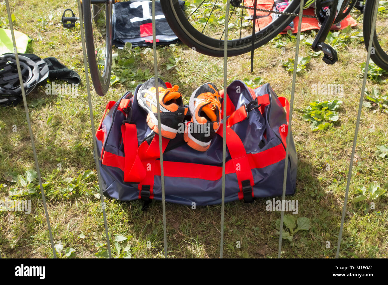 Bike and sports bag in the transition area of a triathlon Stock Photo
