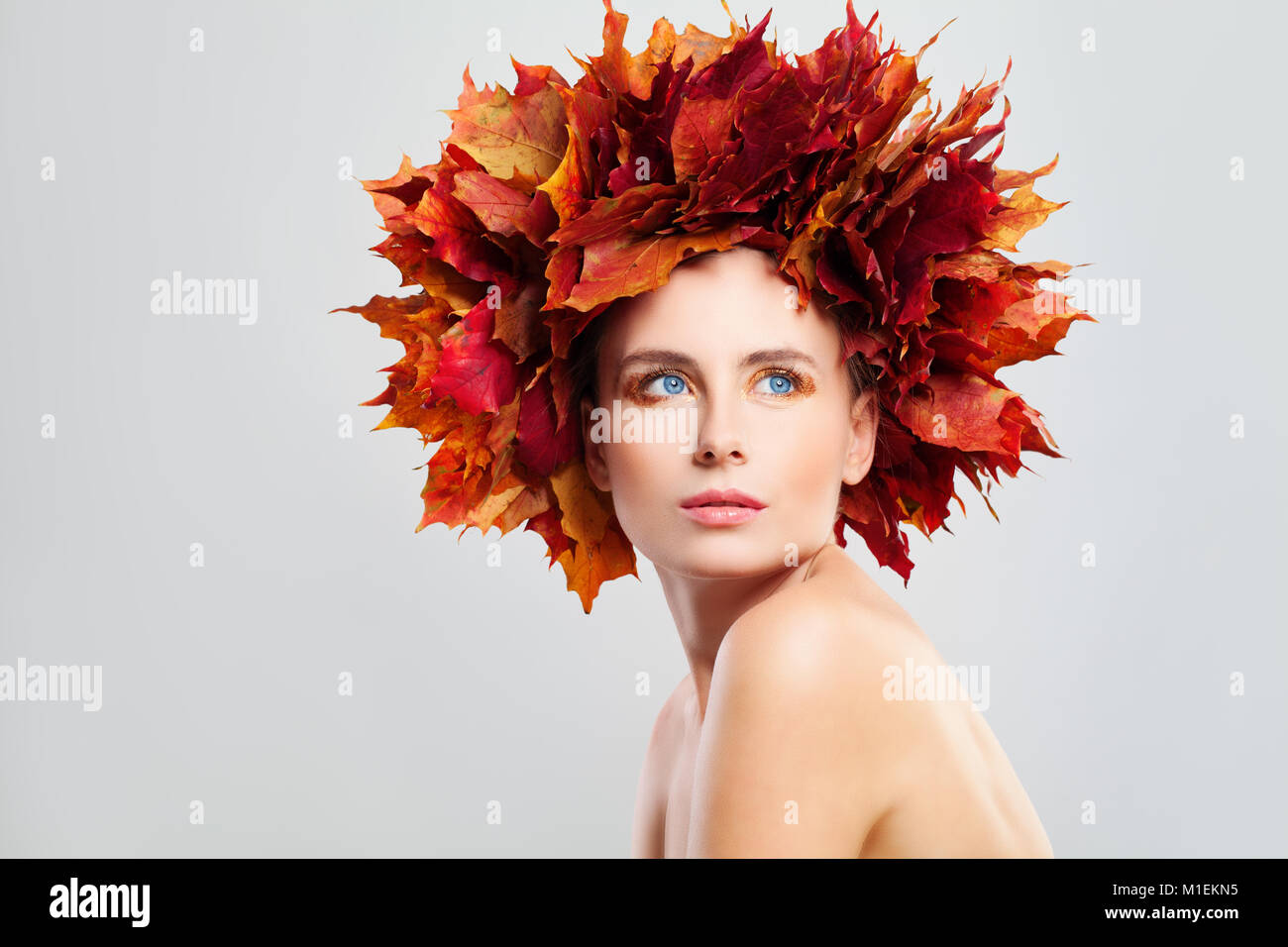 Beautiful Autumn Fashion Model Woman with Fall Maple Leaves on her Head ...
