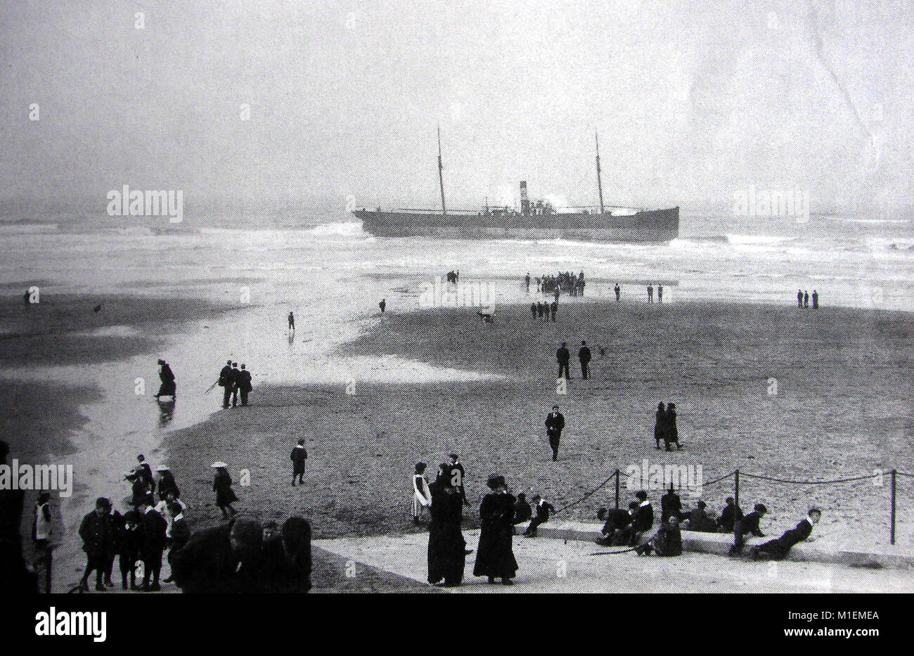 Beach scene 31st May 1902 - The screw steamer S.S. 'Ben Corlick' of North Shields,  stranded at Upgang beach, with loss of life   Whitby, North Yorkshire, UK - Third Engineer Percy Hedley and carpenter E Robinson both lost their lives in trying to escape by rowing boat. Stock Photo