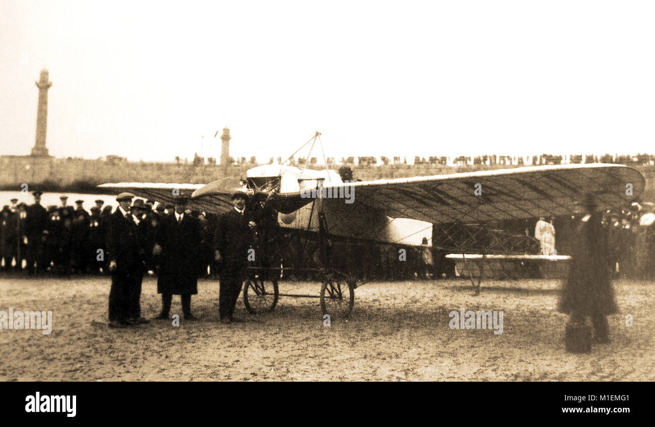 An early photograph from Whitby, North Yorkshire, UK showing a beach scene with an aeroplane which had landed on the sands Stock Photo